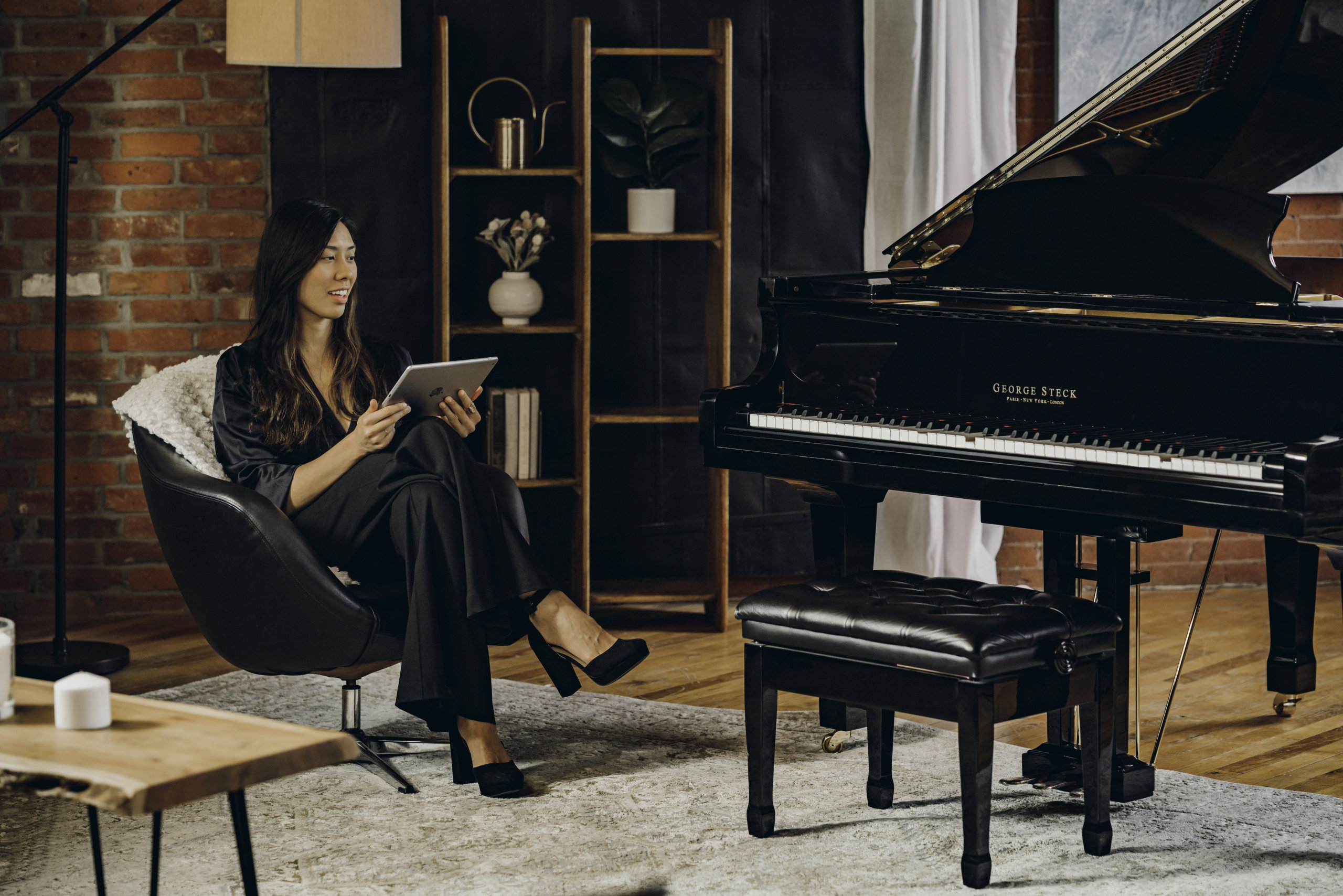 Woman controlling player piano from iPad