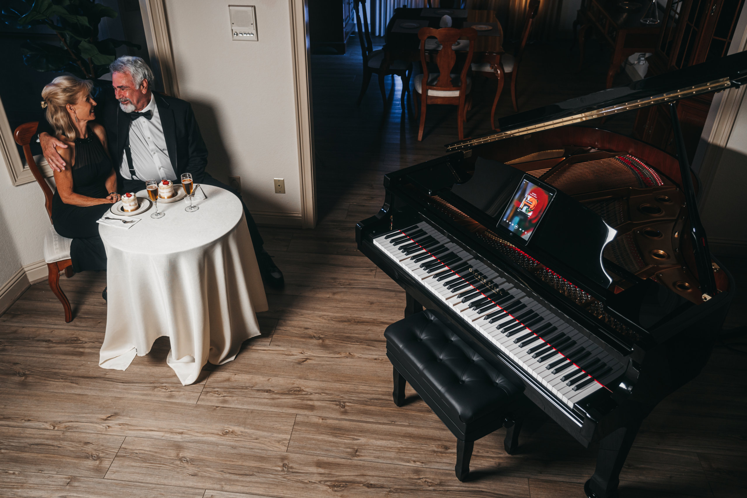 Couple enjoying player piano during dinner