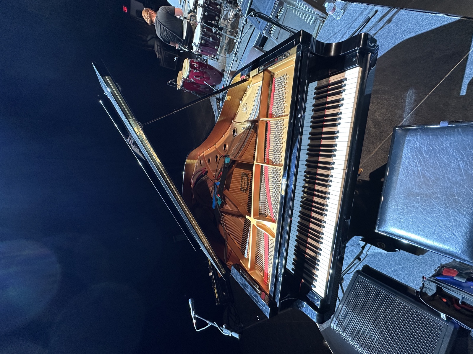 Concert grand prepared for stage performance.