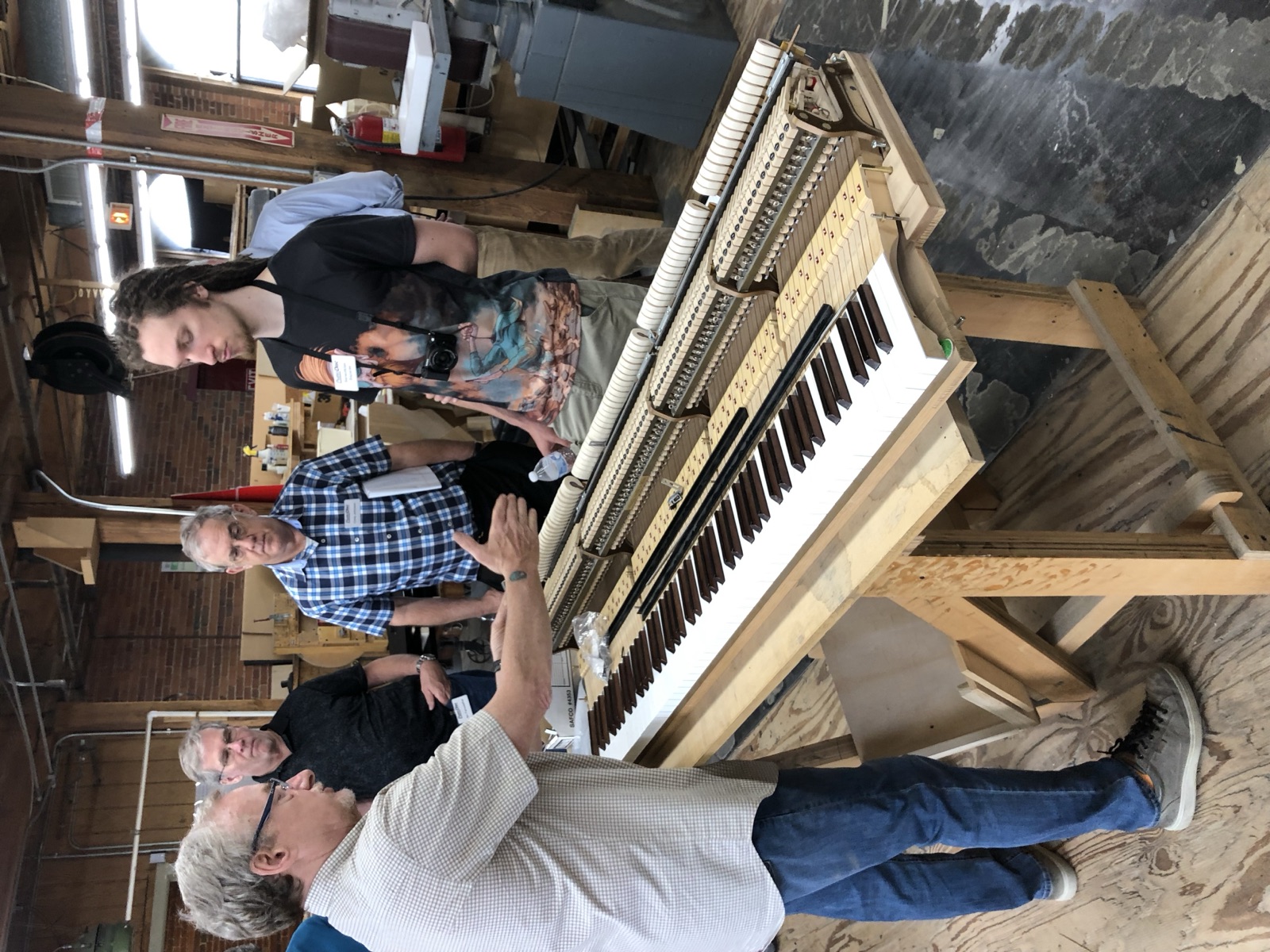 PianoDisc installer certification — working on an upright action.