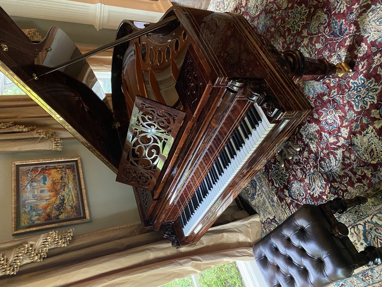 Ornate carved walnut grand piano — DFW area.
